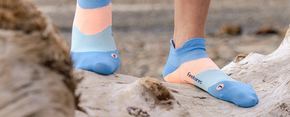 Person walking in a pair of Feetures ultra-light cushion socks