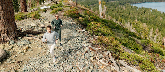 Man and woman trail running