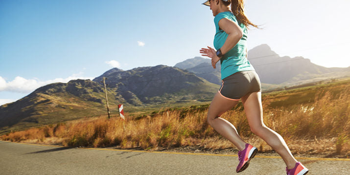 Woman running in desert with no-show socks