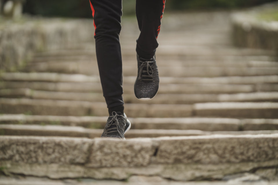 experienced runner running down steps
