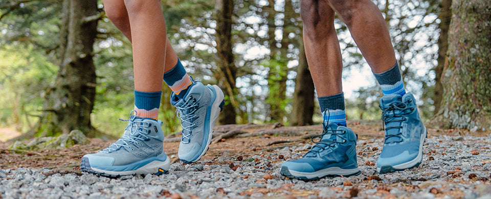 Man and woman hiking in Feetures hiking socks