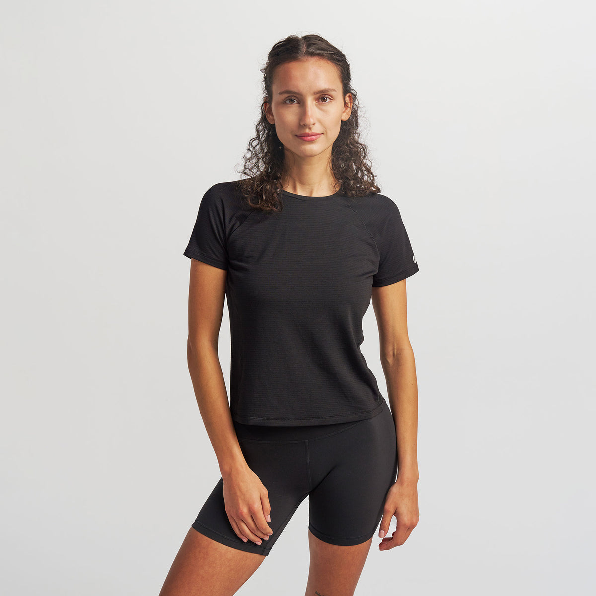 Women’s Stride Flex Performance Tee - Black | model: Elena - Wearing Size Small - Typically a 2/4