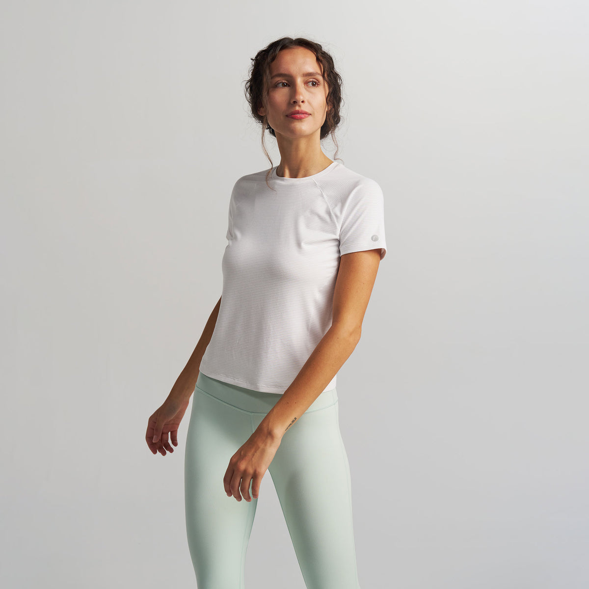 Women’s Stride Flex Performance Tee - White | model: Elena - Wearing Size Small - Typically a 2/4